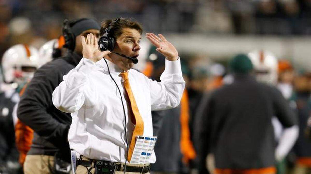 
Miami head coach Al Golden directs his team during the second half of an NCAA college football game against Virginia in Charlottesville, Va., Saturday, Nov. 22, 2014. Virginia won the game 30-13.
