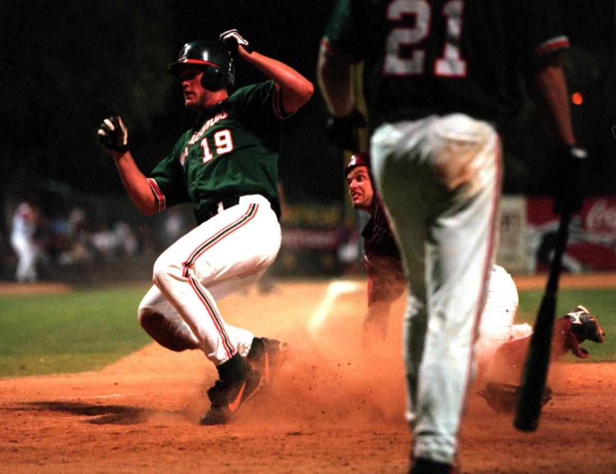 Aubrey Huff scores on a sacrifice fly in the against So Carolina in the fifth inning at the 1998 NCAA Division Baseball Championship.