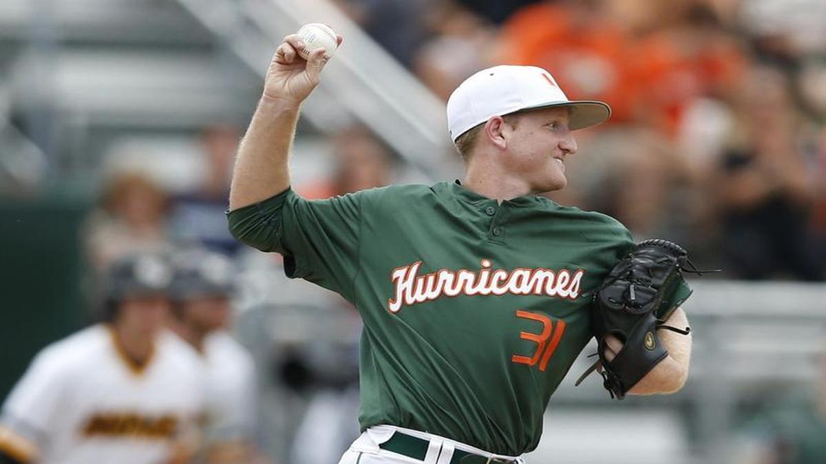 
Miami pitcher Sam Abrams (31) checks the runner at second base in the third inning as the University of Miami hosts VCU Rams at Alex Rodriguez Park at Mark Light Field during the NCAA Super Regional in Coral Gables on June 6, 2015.
