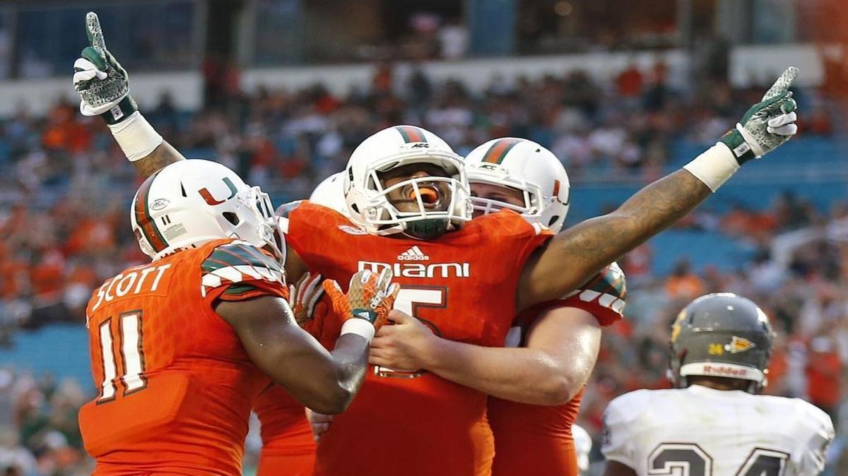 
Miami Hurricanes tight end Standish Dobard (5) celebrates after scoring on a touchdown reception in the first quarter as the University of Miami hosts Bethune Cookman at Sun Life Stadium on Saturday, September 5, 2015.
