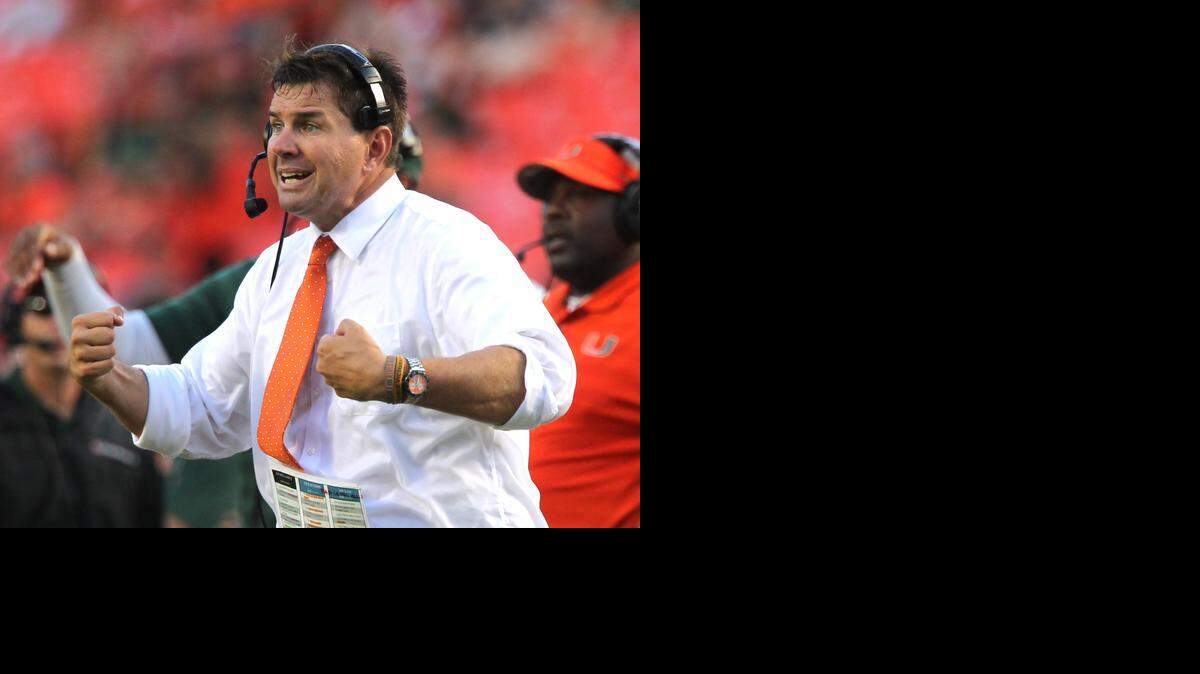 
University of Miami's coach Al Golden on the sideline as the Canes play Arkansas State in the third quarter at Sun Life Stadium in Miami Gardens, Florida, on Saturday, Sept. 13, 2014.

