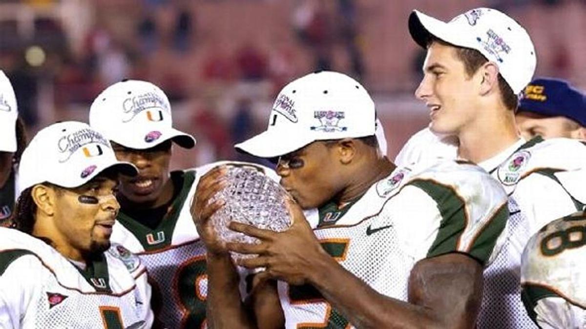 Andre Johnson celebrates Miami’s 2002 Rose Bowl win over Nebraska with teammates Daryl Jones and Ken Dorsey.