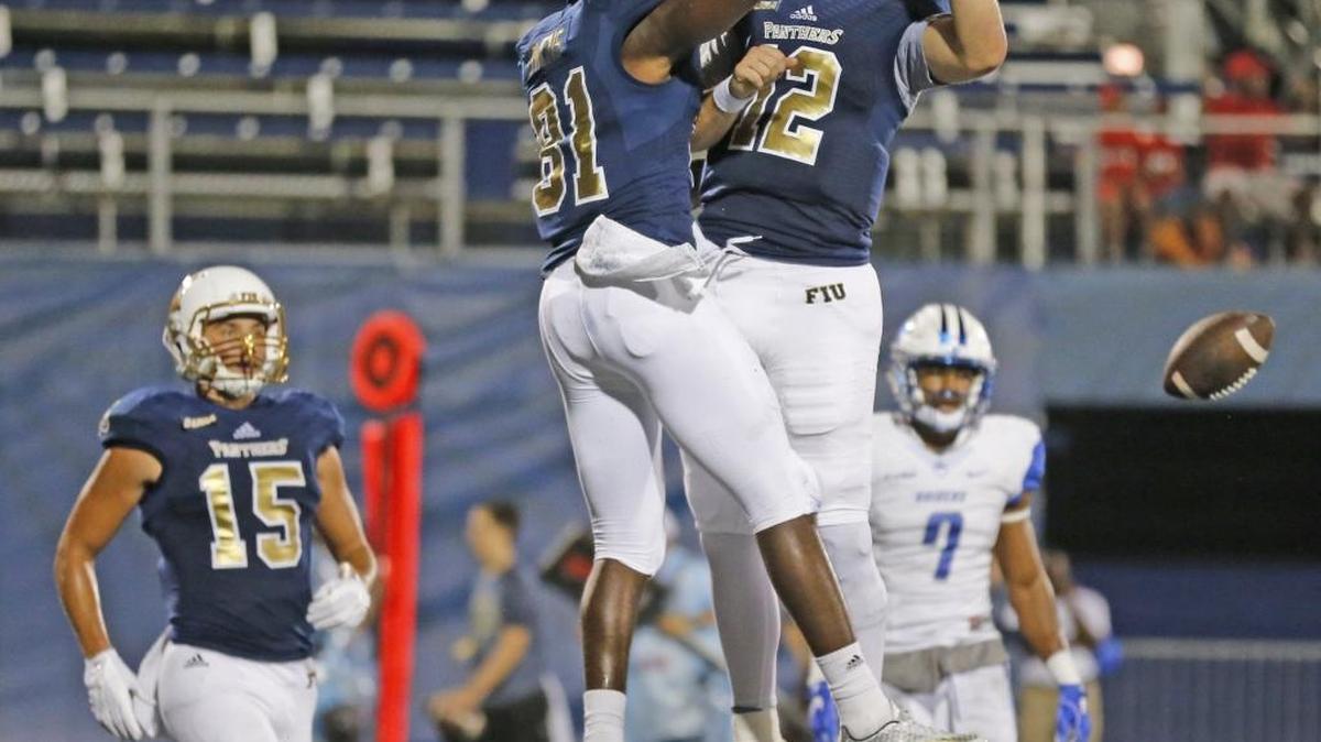 FIU wide receiver Thomas Owens (81) and quarterback Alex McGough (12) celelebrate in the end zone after scoring in the first half of FIU’s 42-35 loss to Middle Tennessee State.