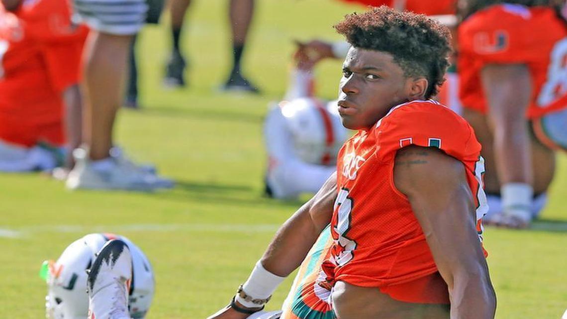Wide receiver Evidence Njoku (83) shown here last week on the fourth day of University of Miami football camp, was on crutches Monday, Aug. 7, with his left knee in a substantial metal brace.
