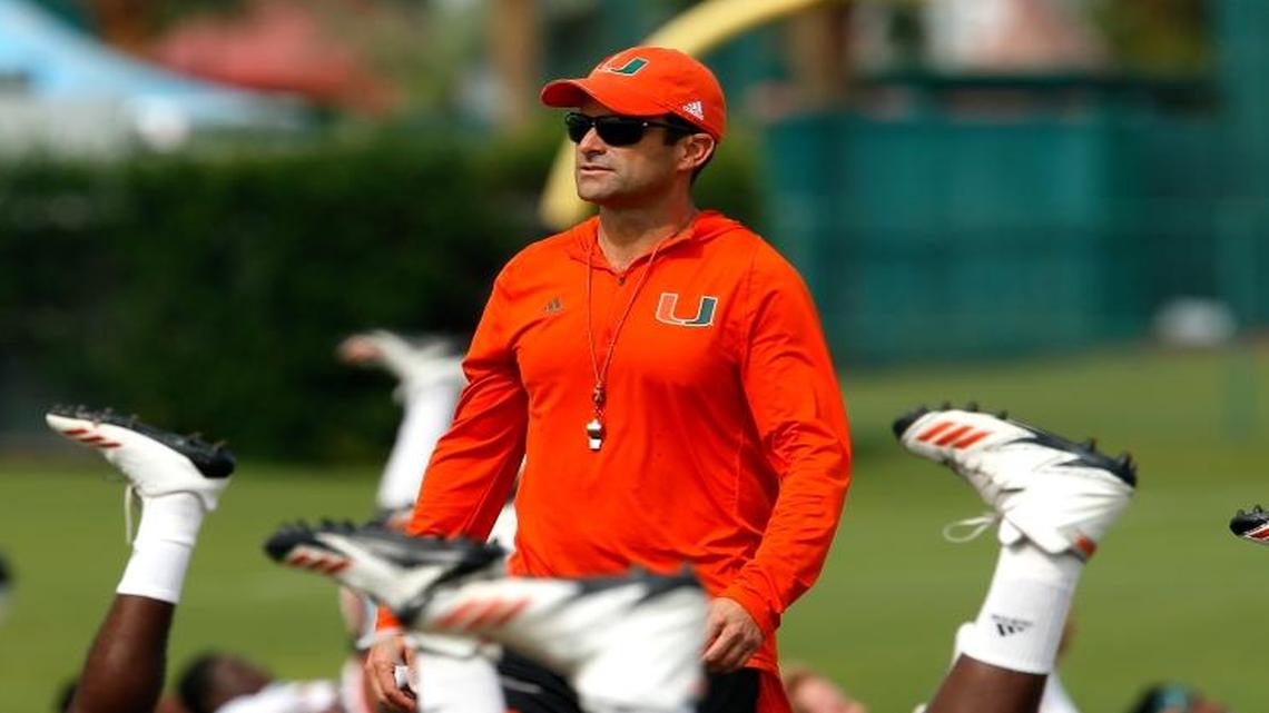 Defensive coordinator Manny Diaz looks over the field as the Miami Hurricanes hold practice at ESPN's Wide World of Sports at Walt Disney World.