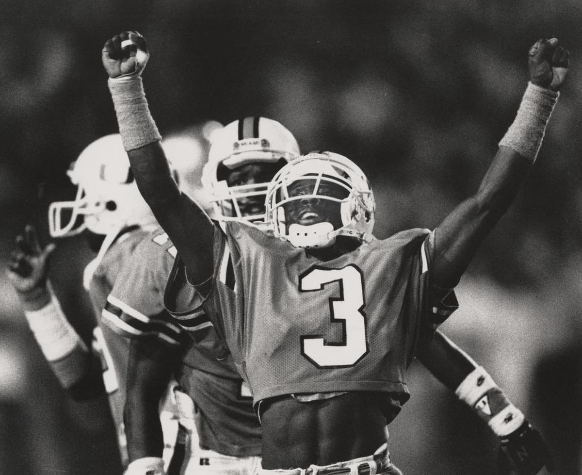 UM’s Randal Hill celebrates after catching a bomb from Craig Erickson for a 44-yard gain during Miami’s 27-10 victory that ended Notre Dame’s 23-game winning streak in 1989.