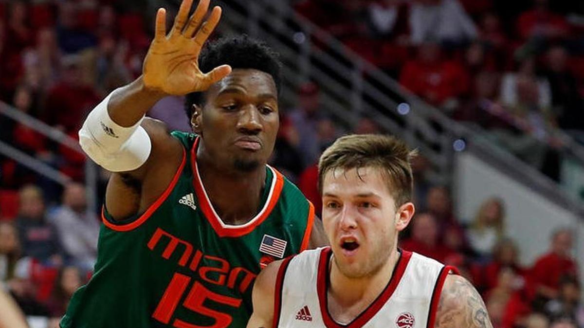 North Carolina State's Braxton Beverly (10) battles Miami's Ebuka Izundu (15) during the first half of the Hurricanes’ 86-81 victory in Raleigh, N.C., on Sunday, Jan. 21, 2018.