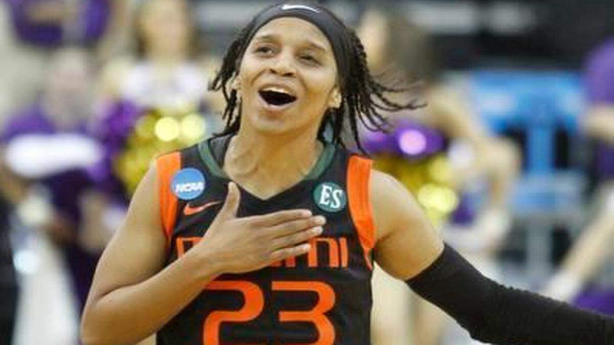 
UM guard Adrienne Motley celebrates after the Hurricanes defeated Washington 86-80 in the first round of the NCAA Tournament in Iowa City, Iowa, Friday March 20, 2015.
