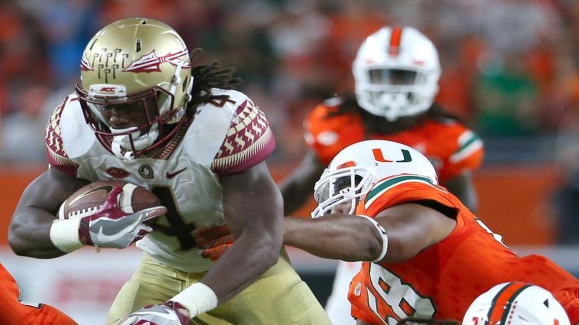 Florida State Seminoles running back Dalvin Cook runs against University of Miami Hurricanes in the second quarter at Hard Rock Stadium on Saturday, Oct. 8, 2016, in Miami Gardens.