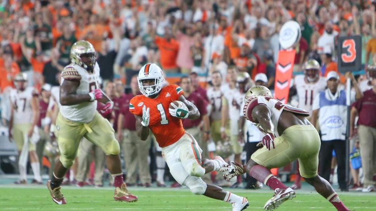 University of Miami Hurricanes running back Mark Walton runs the ball in the second quarter of an NCAA college football game against Florida State Seminoles at Hard Rock Stadium on Saturday October 8, 2016, in Miami Gardens.