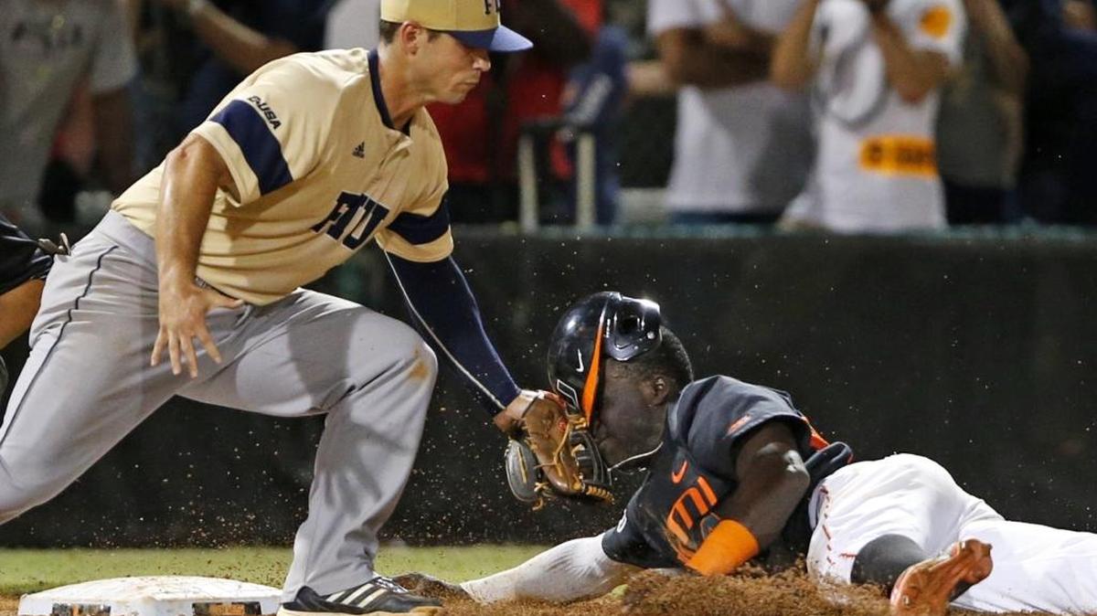 FIU infielder Josh Anderson tagged out Miami Hurricane Jacob Heyward when UM hosted FIU on May 29, 2015, in the NCAA Coral Gables Regional. The Wednesday, Feb. 22, 2017 regular-season game originally scheduled for 7 p.m. at FIU has been postponed because of rain.
