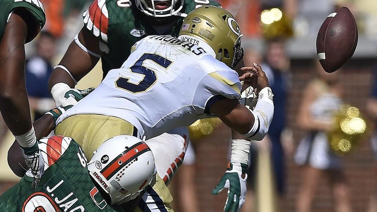 Georgia Tech quarterback Justin Thomas (5) loses the football as Miami defensive lineman Joe Jackson (99) makes the hit on Oct. 1, 2016, in Atlanta. Georgia Tech recovered the fumble but Miami won 35-21. (AP Photo/Mike Stewart)