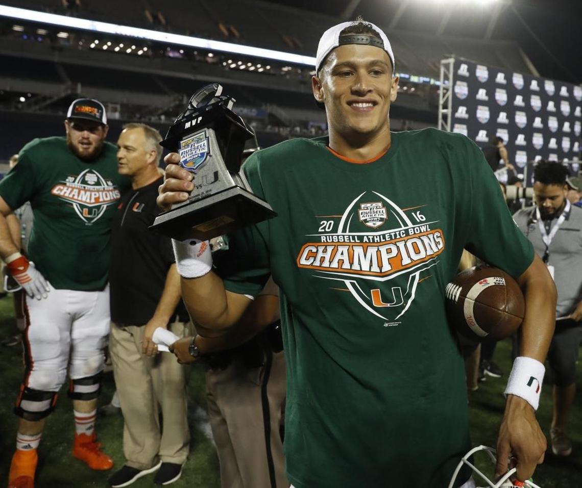 Miami Hurricanes quarterback Brad Kaaya carries his MVP trophy after Miami defeats West Virginia on December 28, 2016.