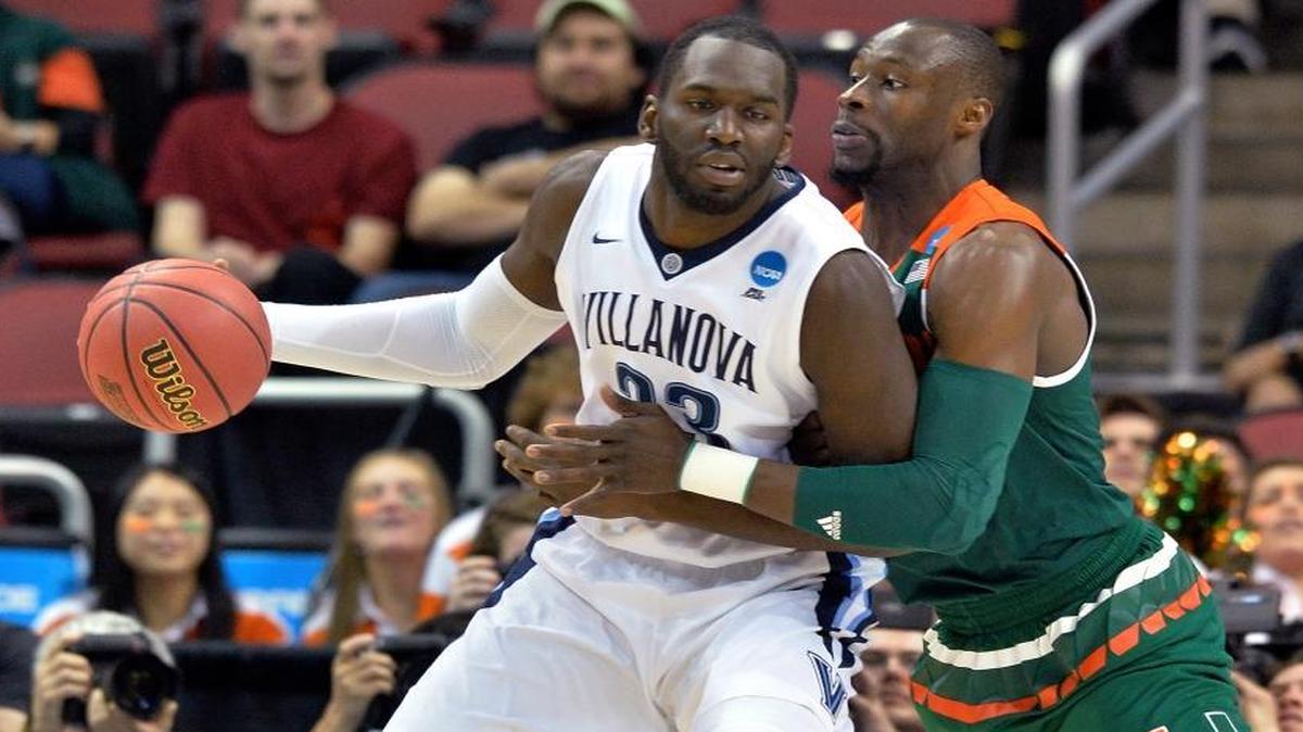 Villanova forward Daniel Ochefu (23) is guarded by Miami center Tonye Jekiri during the first half in the regional semifinals of the NCAA men’s tournament in Louisville, Ky., Thursday, March 24, 2016.