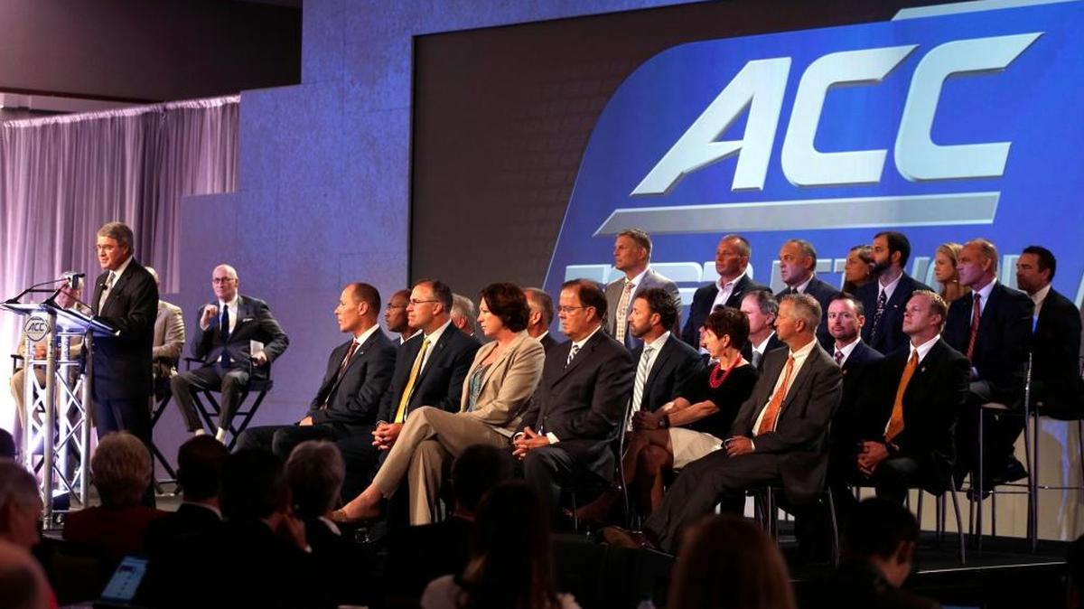 Commissioner John Swofford, left, is flanked by ACC coaches as he announces an ACC/ESPN Network during a news conference at the Atlantic Coast Conference Football Kickoff in Charlotte, N.C., Thurs., July 21, 2016.