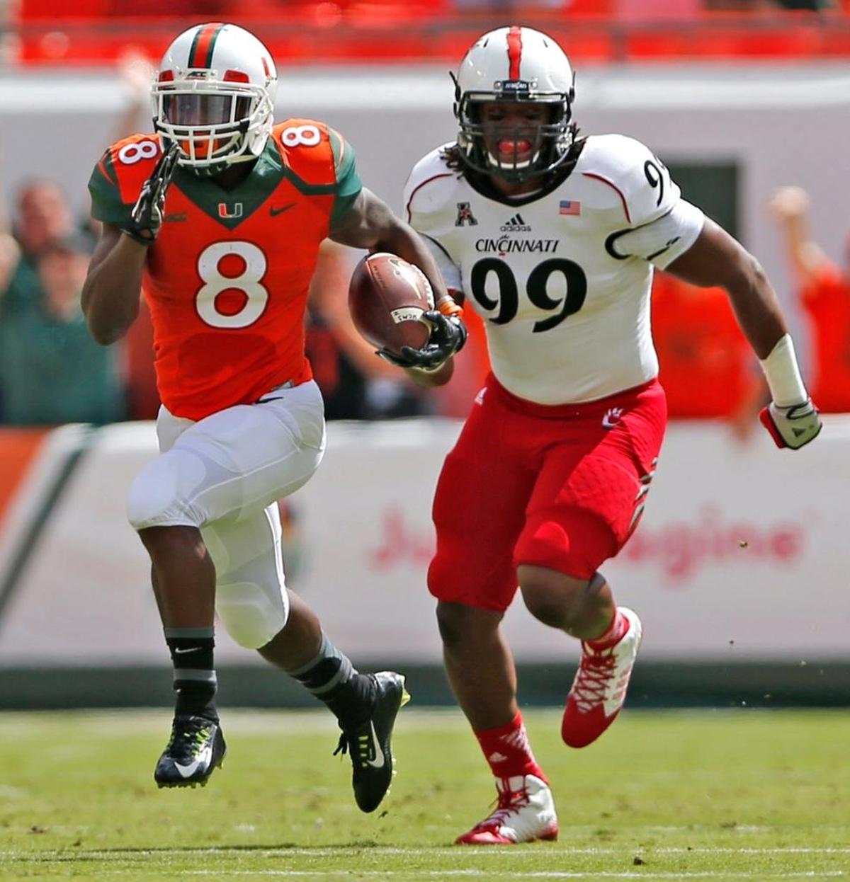 Miami running back Duke Johnson runs for an 80-yard touchdown in the first quarter in a victory over Cincinnati on October 11, 2014.