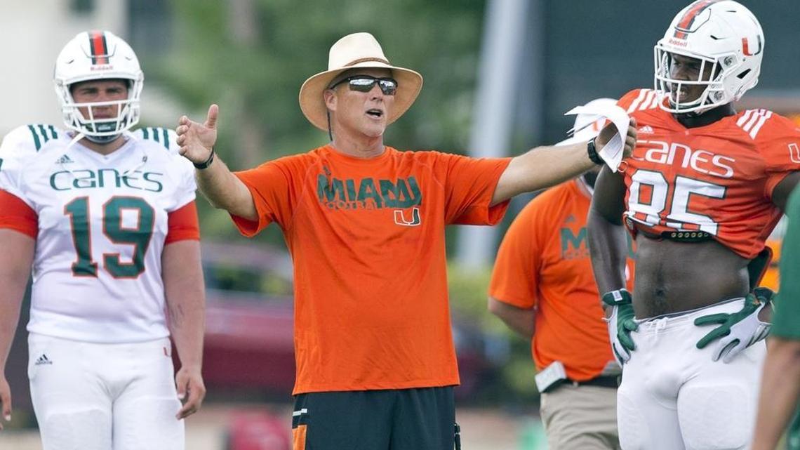 Miami Hurricanes head coach Mark Richt does some instructing during the University of Miami Hurricanes football practice on Tuesday, August 23, 2016.