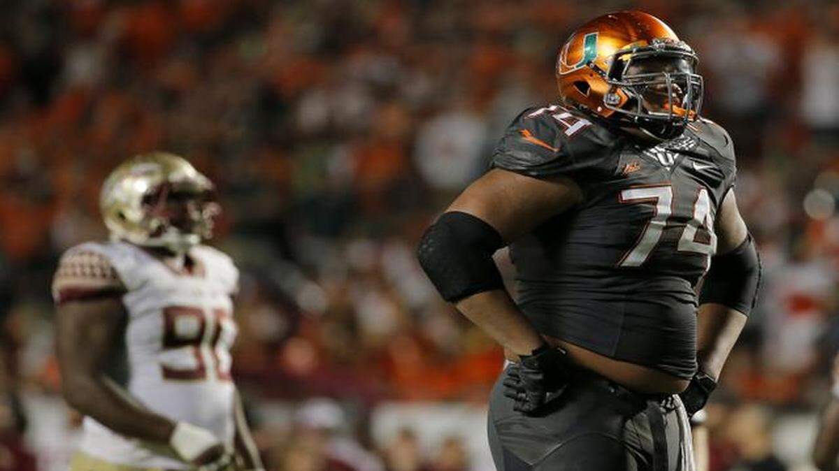 
Miami Hurricanes offensive lineman Ereck Flowers (#74) reacts after a play during the fourth quarter against the Florida State Seminoles at Sun Life Stadium in Miami Gardens on Saturday, November 15, 2014.
