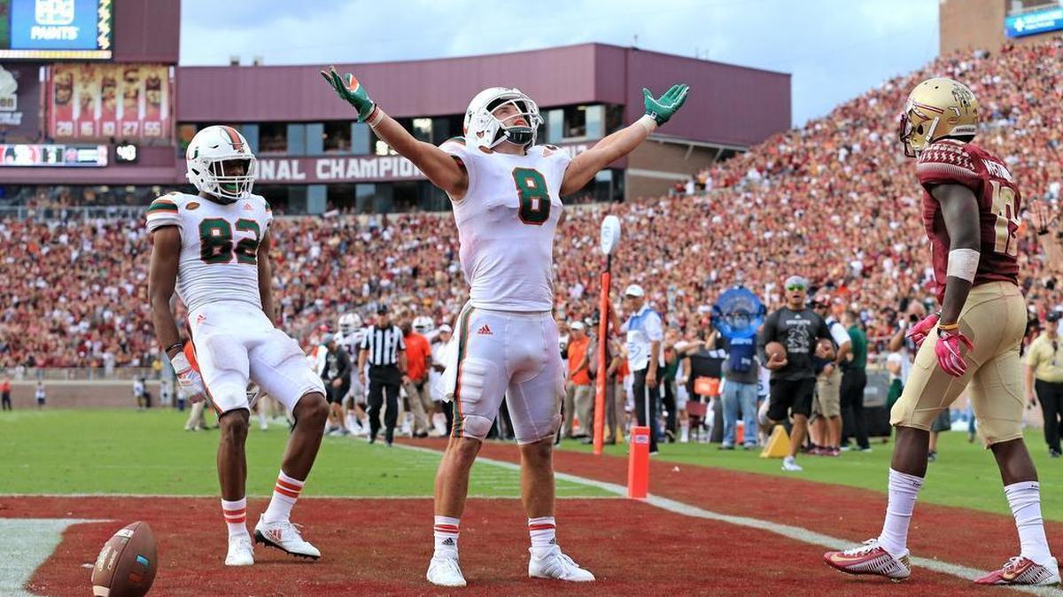 Miami Hurricanes wide receiver Braxton Berrios scores at Florida State’s Doak Campbell Stadium in Tallahassee on Saturday, October 7, 2017.