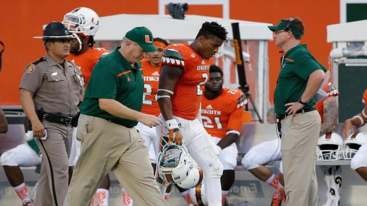 
Miami safety Deon Bush (2) is escorted off the field after he was ejected during the second half of an NCAA college football game against Nebraska, Saturday, Sept. 19, 2015 in Miami Gardens, Fla. Miami defeated Nebraska 36-33 in overtime.
