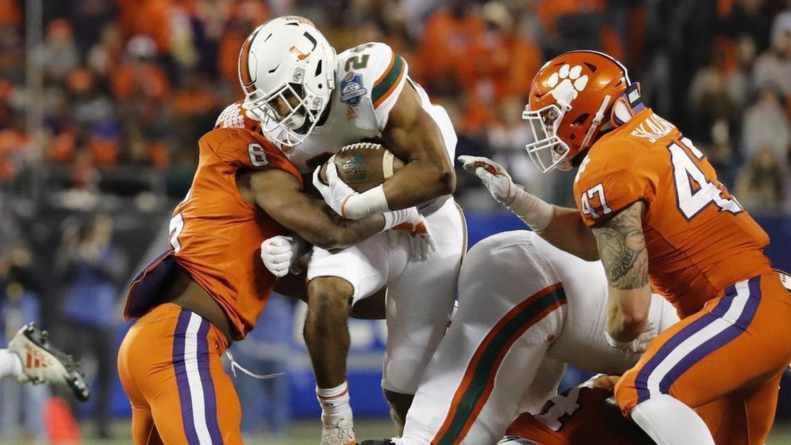 Miami Hurricanes running back Travis Homer (24) carries the ball against the Clemson Tigers in the ACC Championship Game.