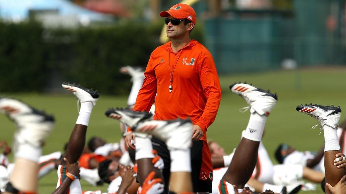 University of Miami defensive coordinator Manny Diaz looks over the field as the Hurricanes hold practice at ESPN’s Wide World of Sports at Walt Disney World in 2017.