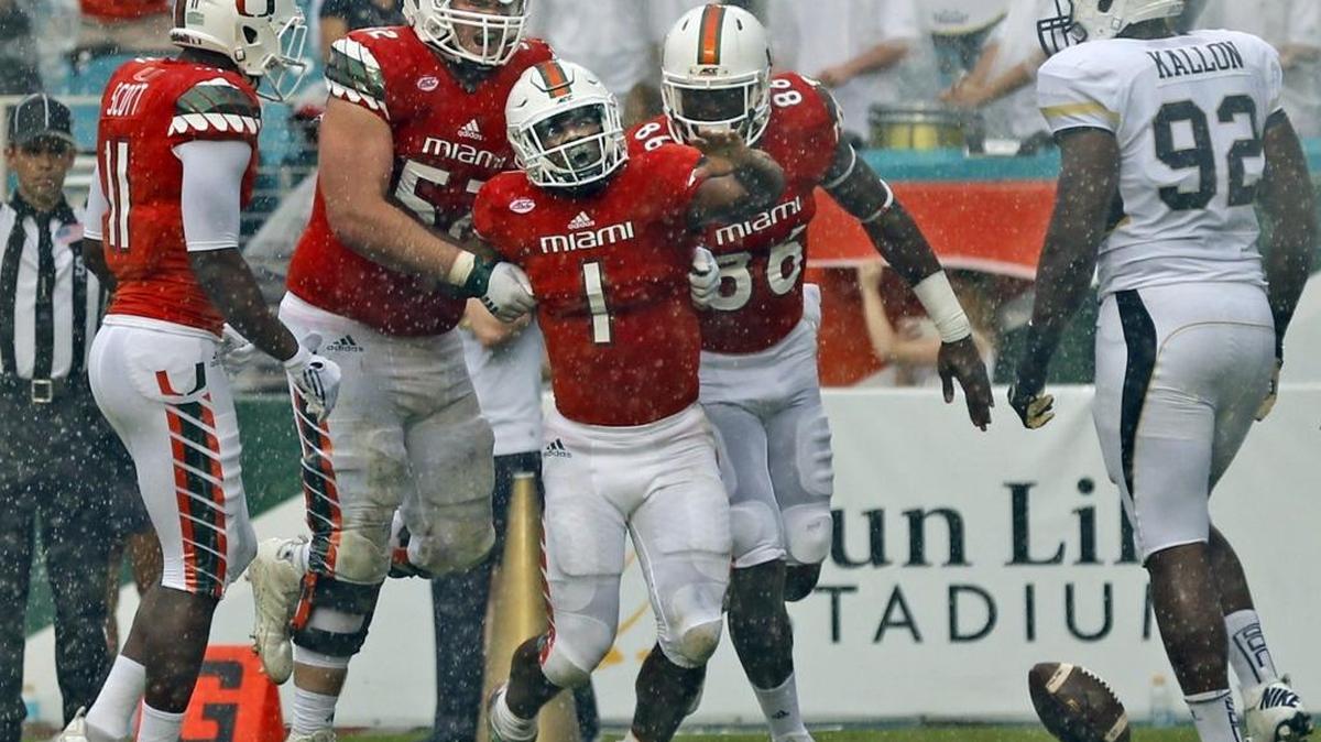 Miami’s Artie Burns helps Miami beat Georgia Tech on November 21.