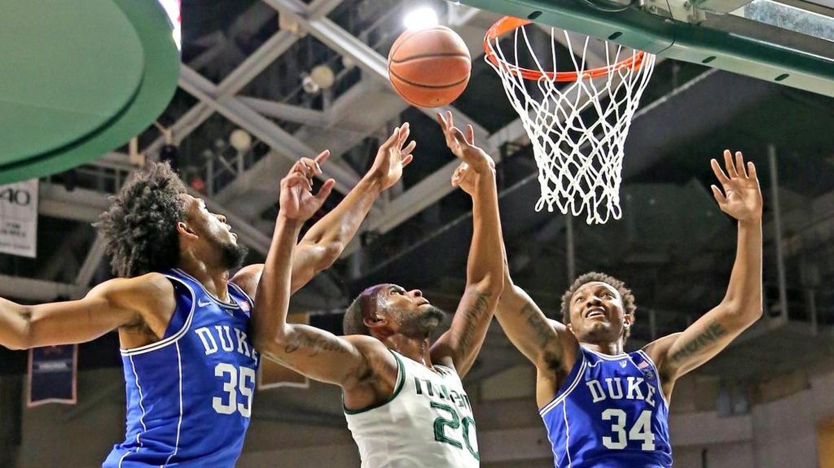 Miami's Dewan Huell (20) fought for a rebound with Duke's Marvin Bagley III (35) and Wendell Carter Jr. (34) during a game in Miami in January.