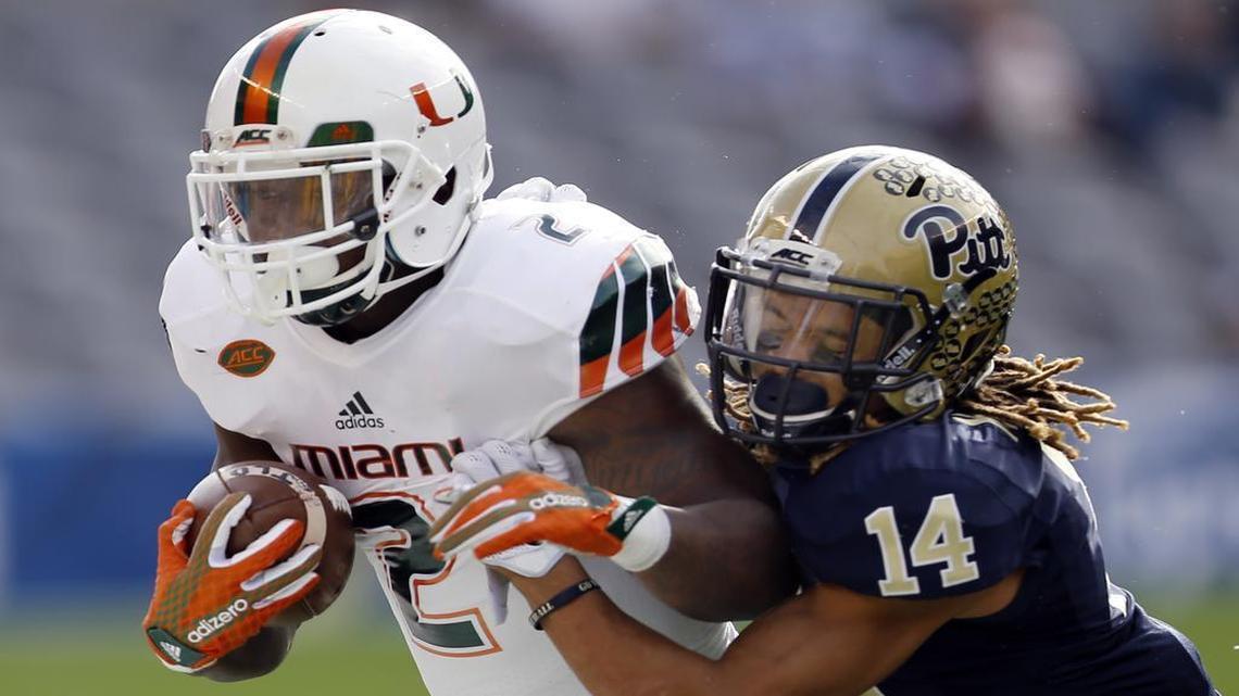 Pittsburgh defensive back Avonte Maddox (14) knocks Miami running back Joseph Yearby (2) out of bounds after he ran for a first down in the first quarter of an NCAA college football game, Friday, Nov. 27, 2015, in Pittsburgh.