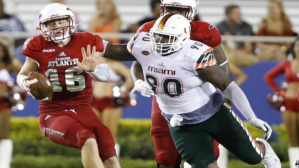 UM defensive lineman Courtel Jenkins (90) sacks Florida Atlantic QB Jason Driskel at FAU Stadium in Boca Raton on Friday, Sept. 11, 2015.