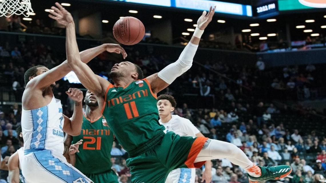 North Carolina forward Kennedy Meeks, left, stops Miami guard Bruce Brown (11) from scoring during the first half of an NCAA college basketball game in the Atlantic Coast Conference tournament, Thurs., March 9, 2017, in New York.