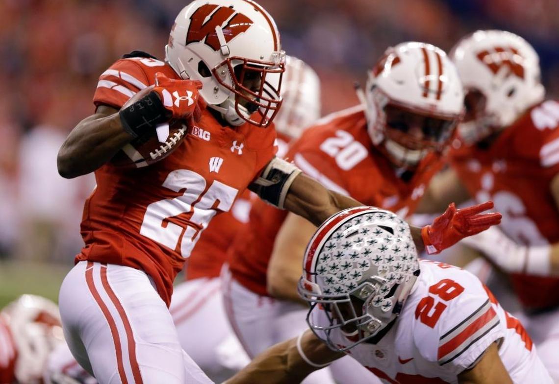 Wisconsin cornerback Derrick Tindal as Ohio State running back Jordan Leasure defends during the first half of the Big Ten championship NCAA college football game on Saturday, Dec. 2, 2017, in Indianapolis.