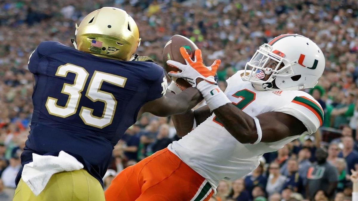 Notre Dame 's Donte Vaughn (35) breaks up a pass intended for Miami 's Stacy Coley (3) during the second half of an NCAA college football game Sat., Oct. 29, 2016, in South Bend, Ind.