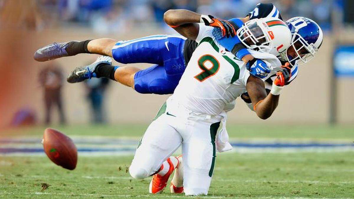 
Duke safety Jeremy Cash breaks up a pass intended for UM’s Malcolm Lewis at Wallace Wade Stadium on Nov. 16, 2013 in Durham, North Carolina. 
