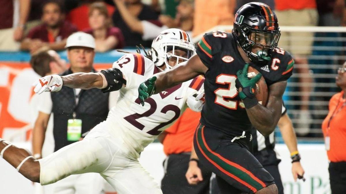 Miami Hurricanes tight end Christopher Herndon IV scores in the third quarter against the Virginia Tech Hokies at Hard Rock Stadium on Saturday, Nov. 4, 2017.
