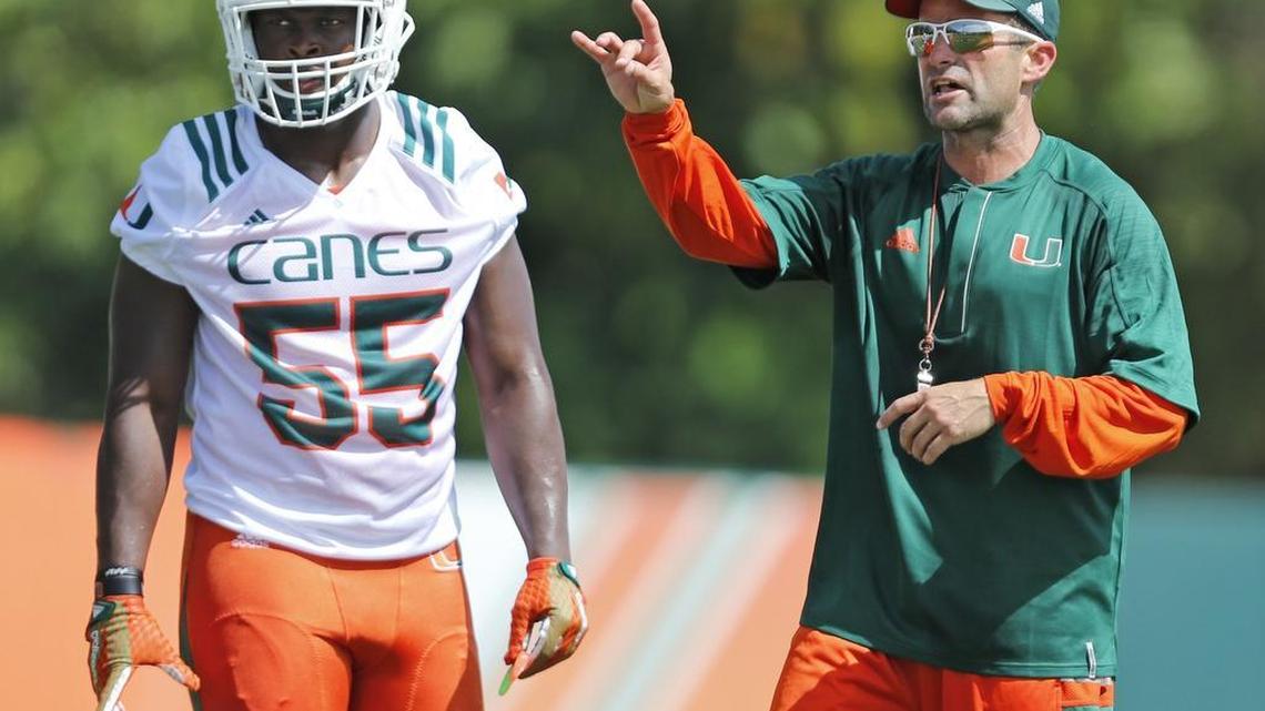 Miami Hurricanes linebacker Shaquille Quarterman with Miami defensive coordinator Manny Diaz during opening day of Miami Hurricanes football practice in Coral Gables on Thursday, August 4, 2016.