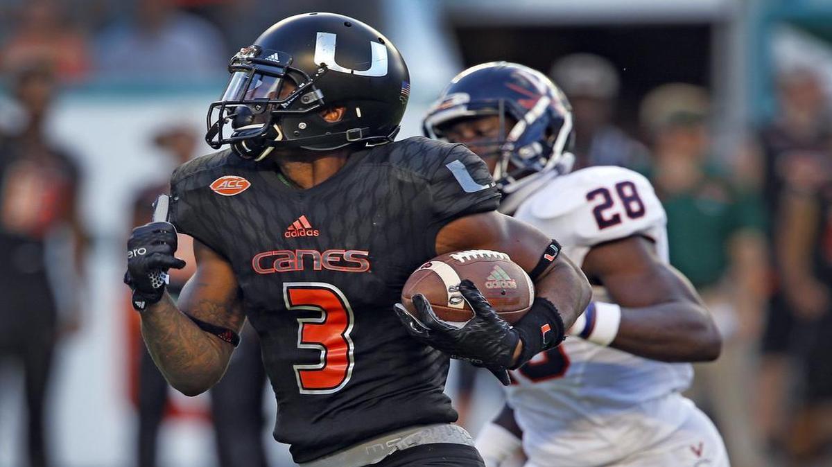 UM’s Stacy Coley runs for a second quarter touchdown after a reception as they play the Virginia Cavaliers at Sun Life Stadium in Miami Gardens on November 7, 2015.