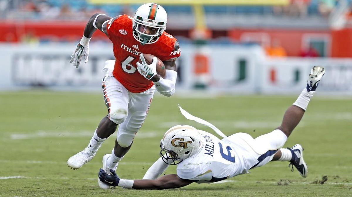 Miami Hurricanes wide receiver Herb Waters (6) earns a first down in the first quarter as the University of Miami hosts Georgia Tech at Sun Life Stadium on Saturday, November 21, 2015.