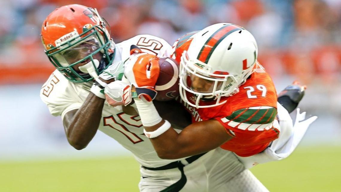 Miami Hurricanes defensive back Corn Elder (29) intercepts the ball intended for Florida A&M Rattlers wide receiver Montavius Williams (15) in the first quarter as the University of Miami hosts Florida A&M at Hard Rock Stadium on Sat., Sept. 3, 2016.