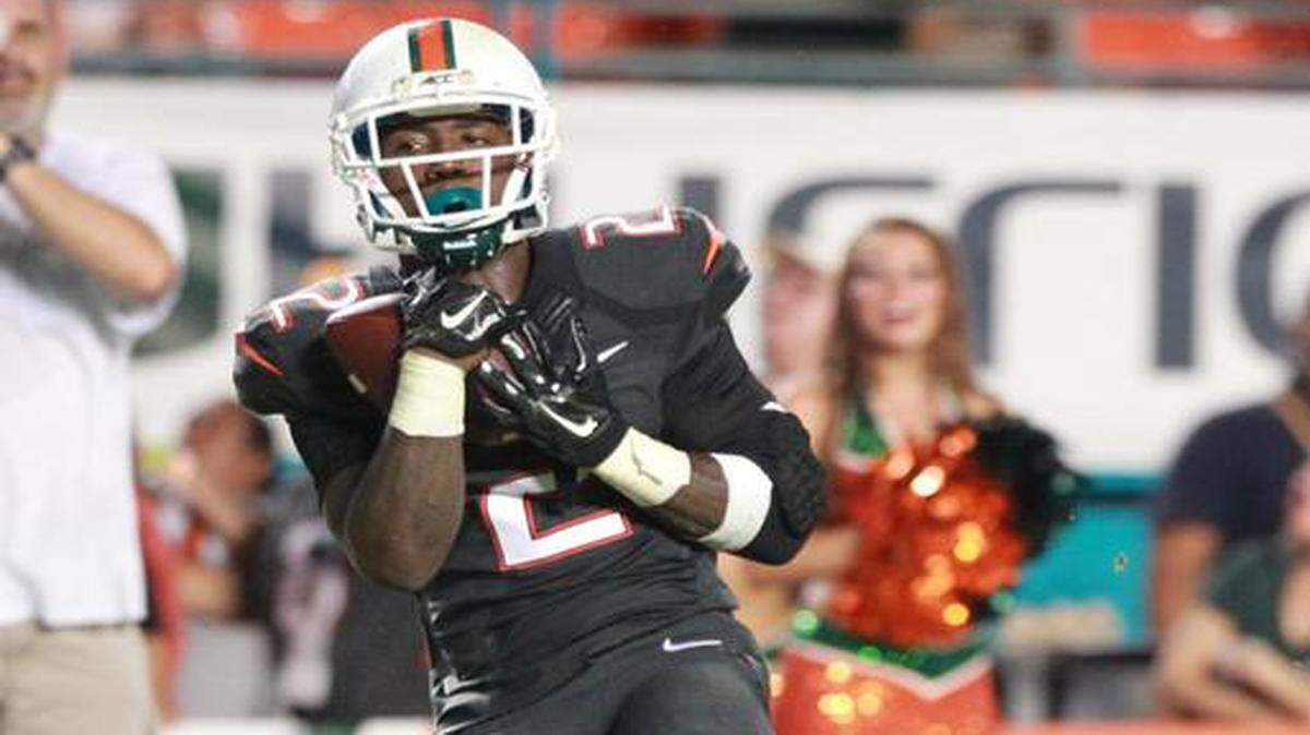 
Miami Hurricanes’ Joseph Yearby catches a fourth quarter touchdown as they play the Duke Blue Devils at Sun Life Stadium in Miami Gardens, Florida, September 27, 2014.
