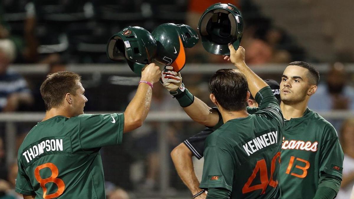 
Miami’s David Thompson and Garrett Kennedy congratulate Willie Abreu, right, after Abreu hit a three-run home run in the sixth inning against Columbia on Monday night at Mark Light Field.
