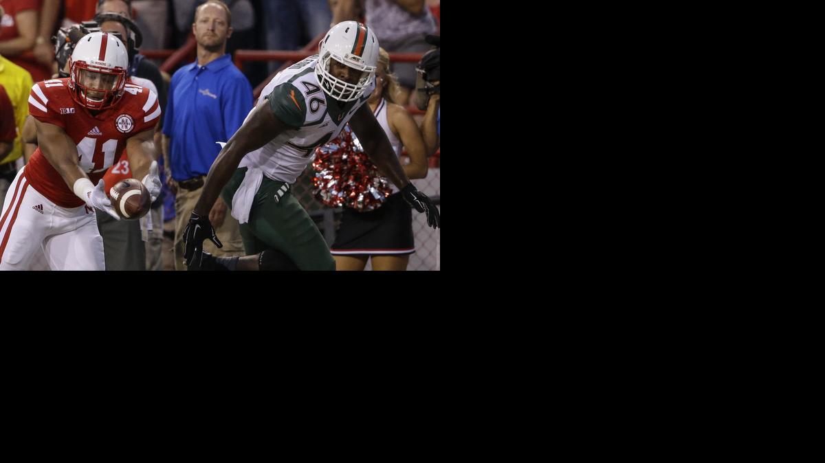 Nebraska linebacker David Santos (41) intercepts a pass intended for Miami tight end Clive Walford on Saturday, Sept. 20, 2014. 
