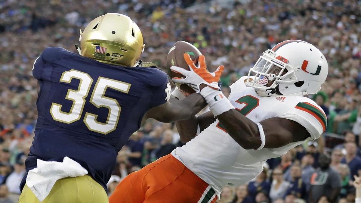 Notre Dame defensive back Donte Vaughn (35) breaks up a pass intended for Miami wide receiver Stacy Coley (3) during the second half of an NCAA college football game at Notre Dame Stadium in South Bend, Ind. on Oct. 29, 2016.