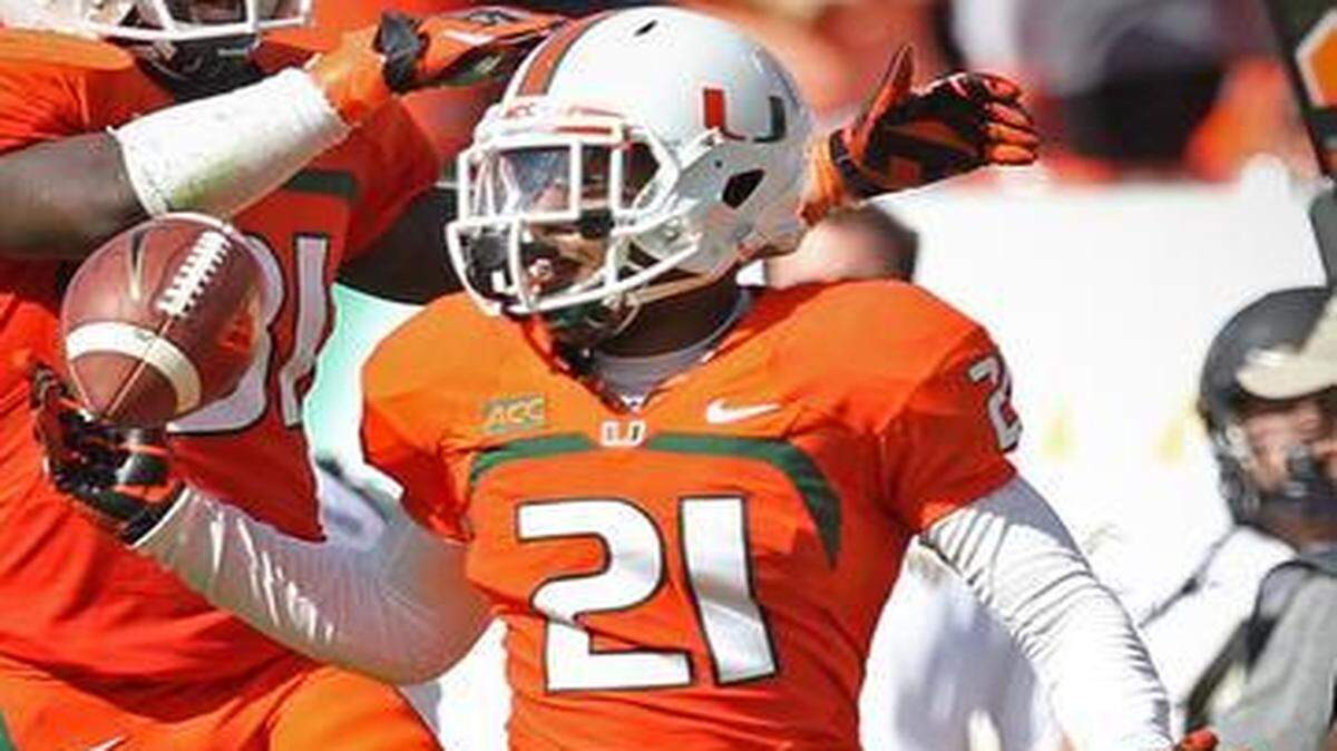 
UM cornerback Antonio Crawford intercepts a pass against Wake Forest at Sun Life Stadium on Saturday, Oct. 26, 2013.
