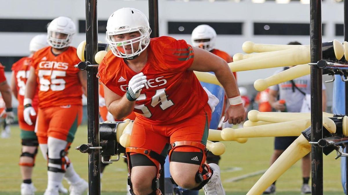 
Offensive lineman Hunter Knighton (54) participates in drills during Day 2 of UM Fall Camp at the Greentree Field on Friday, Aug. 7, 2015.
