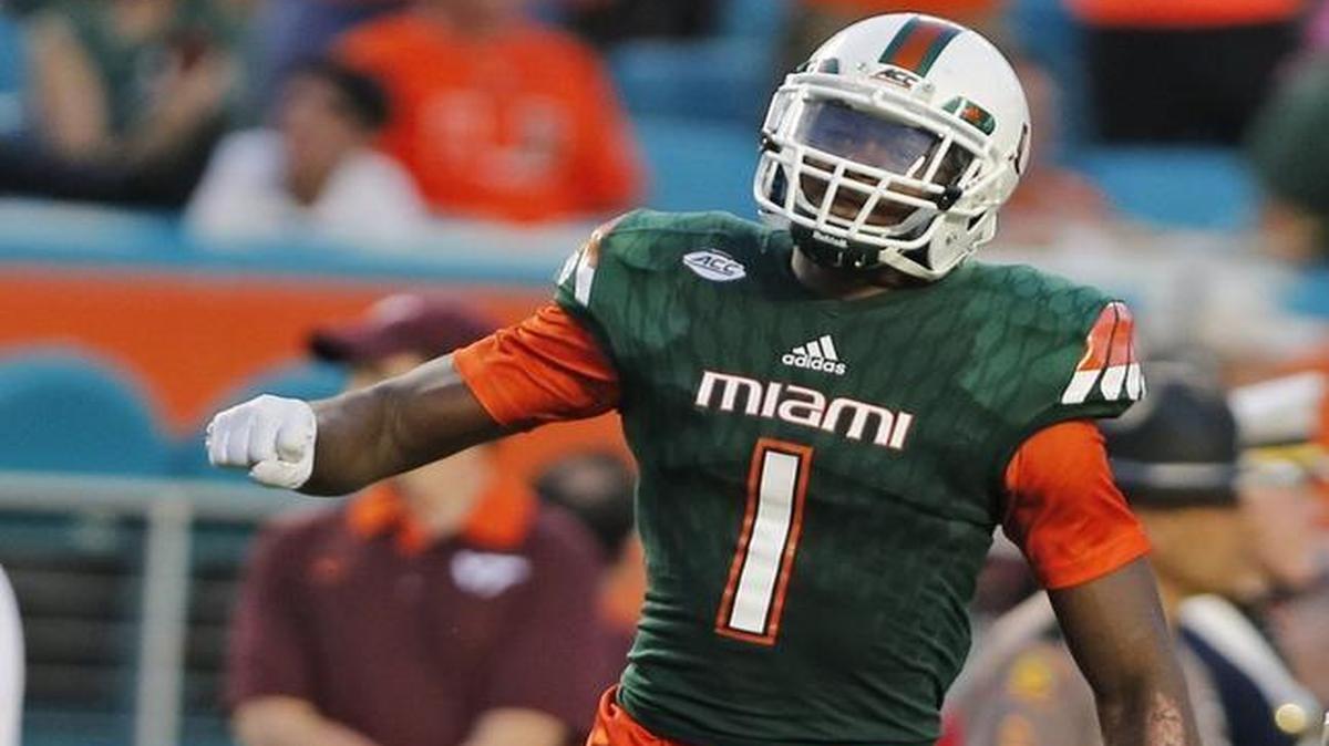 Miami Hurricanes defensive back Artie Burns pumps his chest after he intercepts the ball in the fourth quarter as the University of Miami hosts Virginia Tech at Sun Life Stadium on Saturday on Saturday, October 17, 2015.