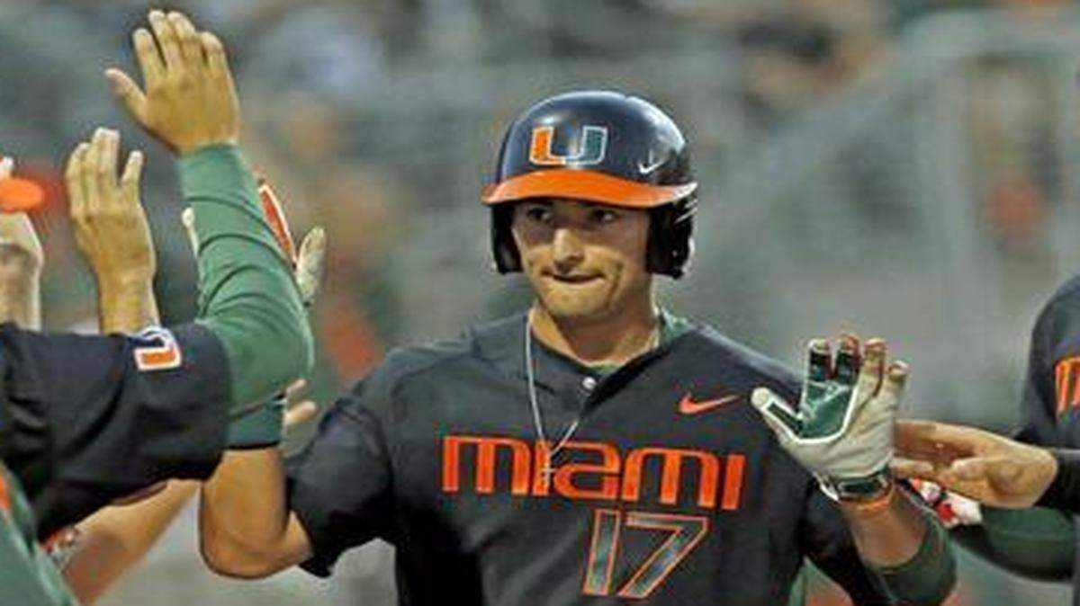 
UM first baseman Christopher Barr (17) scores on an error in the second inning against North Carolina State at Mark Light Field on Saturday, March 14, 2015.
