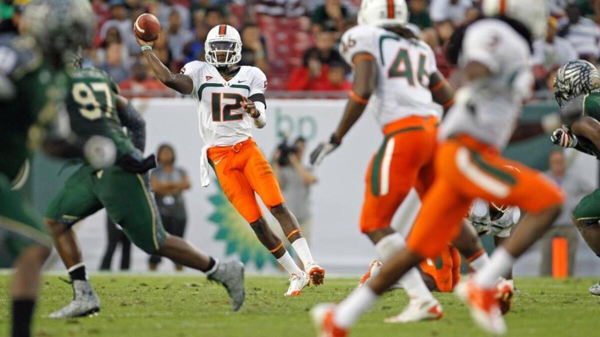 Miami's Jacory Harris looks to pass in the third quarter against USF at Raymond James Stadium November 19, 2011.