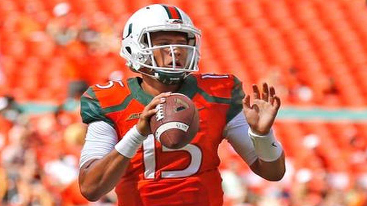 
UM quarterback Brad Kaaya looks to pass in the third quarter against Cincinnati at Sun Life Stadium on Saturday, Oct. 11, 2014.

