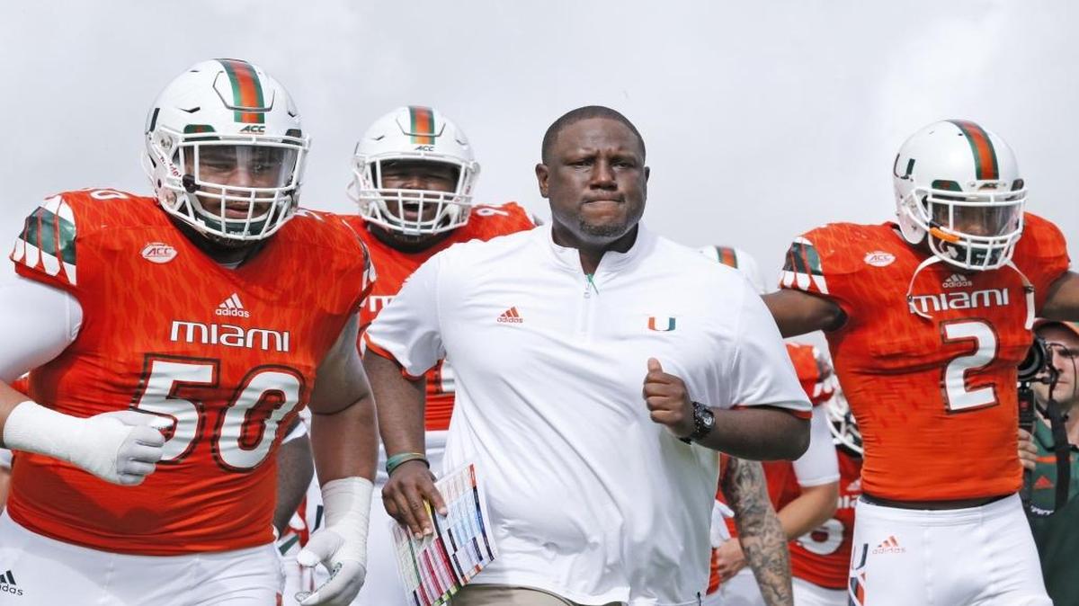 Head coach Larry Scott rushes the field with players as the University of Miami hosts Georgia Tech at Sun Life Stadium on Saturday, November 21, 2015.